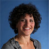 Portrait of Nancy Friedman on blue background